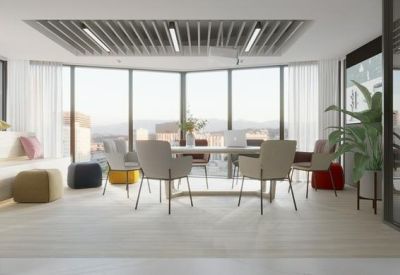 Glass-walled meeting room with panoramic city views and a central table.