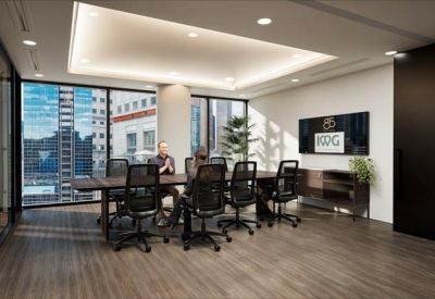 Professional meeting room at 85 Spring Street with wood floors and city views.