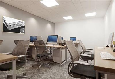 A modern six-person office suite with ergonomic grey mesh chairs and dual monitor setups.