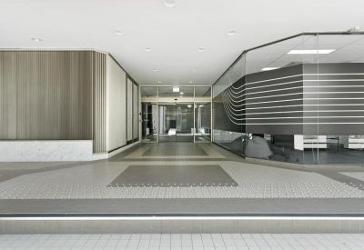Wide view of the glass entrance and lobby area at 90 Phillip Street.