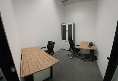 Private office with two desks and a storage cabinet.