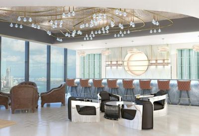 Modern communal bar and lounge area with sleek white furniture and panoramic city views.
