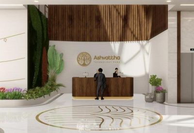 Sleek wooden reception desk backed by a vertical garden wall and wood paneling.