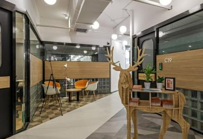 Reception area or corridor featuring a unique wooden reindeer-shaped bookshelf.