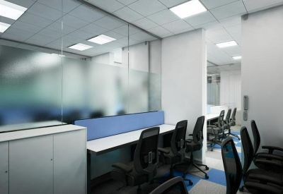 Private office space with rows of black chairs and desks separated by frosted glass walls.