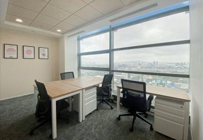Bright corner office suite with large windows and city views.