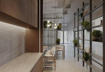 Bright hallway with wooden cabinetry, high chairs, and shelving units with green plants.