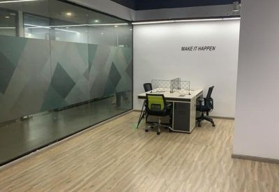 Minimalist two-person office suite featuring a white desk with a glass partition and lime green chair.