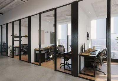 Private glass-partitioned office suites with ergonomic chairs and wooden desks.