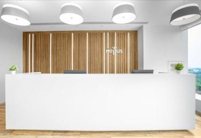 Reception area featuring a minimalist white front desk against a vertical wood-slat feature wall.