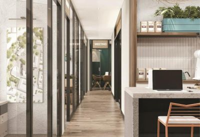 Modern corridor view showing glass-walled offices and a glimpse of a cafe counter.