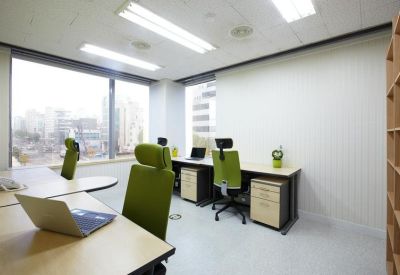 Three-person office suite featuring large windows and rolling storage units.