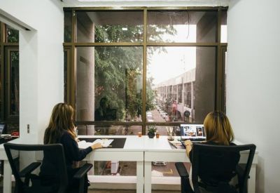 Small meeting room or workspace with a large window overlooking the street.