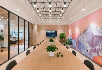 Professional boardroom with a long wooden table, potted plants, and a colorful mountain mural.