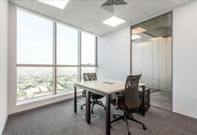 Private office for two featuring floor-to-ceiling windows with panoramic city views.