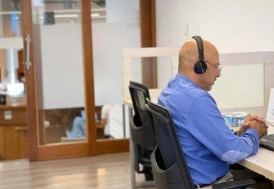 Private workstation area with wooden partitions and ergonomic chairs.