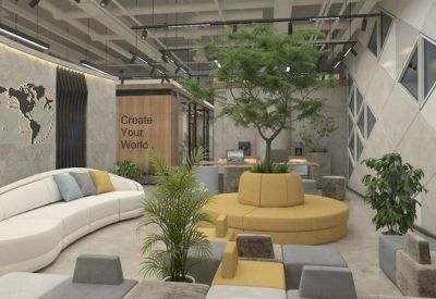 Vibrant communal lounge with a curved white sofa, yellow seating, and a large indoor tree.