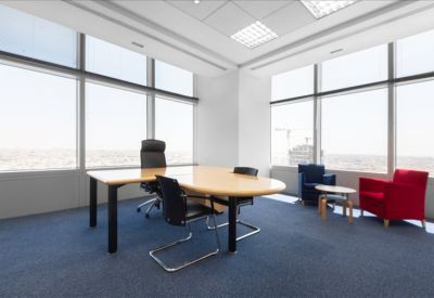 Private corner office with an executive desk and floor-to-ceiling city views.