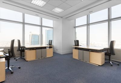 Spacious two-desk office suite with ergonomic chairs and natural light.