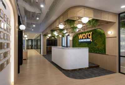 Reception and lobby area at Menara Shell, 211, Jalan Tun Sambanthan, Kuala Lumpur with a lush green moss feature wall.