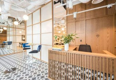 Reception area with a slatted wood desk, tiled floor, and a frosted glass partition wall.