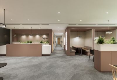 Spacious lobby area with reception desk and cozy seating booths.