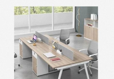 Clean and professional four-person workstation with white A-frame legs.