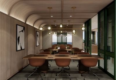 Dedicated workstation area with long wooden desks and green glass partition walls.