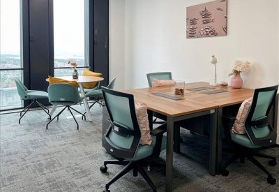 Private office with four desks and city views.