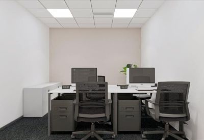 Modern private office with grey carpet and two workstations.
