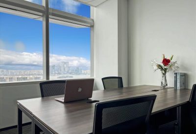 Meeting room with a large wooden table and city skyline views at Tower 1, Jinghope Plaza.
