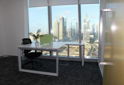Corner office workstation with an expansive view of Burj Khalifa and downtown.