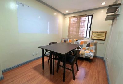 Small meeting room with a quilted sofa.