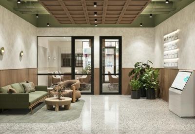 Lobby and reception lounge area at 116, Martin Street, Brighton featuring a green sofa and timber accents.