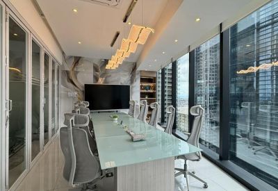 Long conference table in a glass-walled room at 11th Ave. Corner 32nd Street.