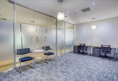 Private office space with frosted glass partitioning and dedicated workstations.