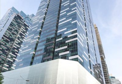 Exterior view of the glass-facade China Life Tower showing its modern high-rise architecture.