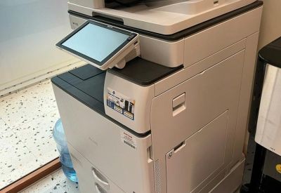 Close-up of a professional office multi-function printer and copier.