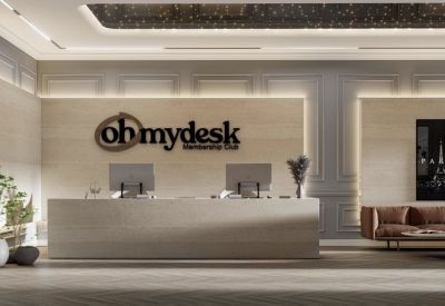 Branded reception area with a long stone desk and elegant wall paneling.