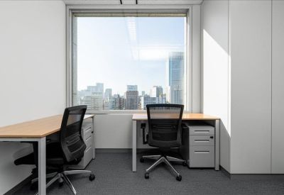 Private office suite for two with large window overlooking the city skyline.