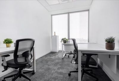 Modern two-person private office with ergonomic chairs and city views.