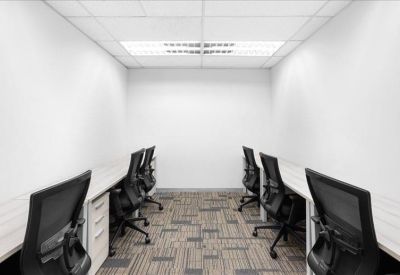 Symmetrical internal six-person office suite with black mesh chairs and white desks.