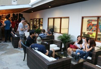 Outdoor terrace with comfortable sofa seating and a casual social atmosphere.