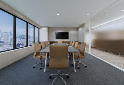Professional boardroom with a large table, leather chairs, and city backdrop.
