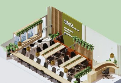 Isometric floor plan rendering of the Hiraya coworking and study hub showing desk layouts and greenery.