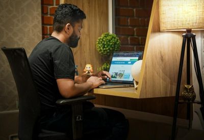 Person cooking in a kitchen with bright, warm lighting.