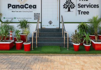 Entrance of PanaCea and The Services Tree with potted plants at 32CL, Abdalian Society.