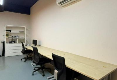 Long workspace with minimalist design and shelving.
