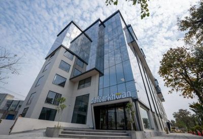 Exterior view of the modern glass-facade building at 34-S Main Boulevard, Block K, Gulberg.