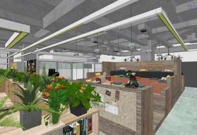 Open-plan office space with wood-paneled cubicles, hanging lights, and many green plants.